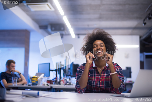Image of portrait of a young successful African-American woman in modern 