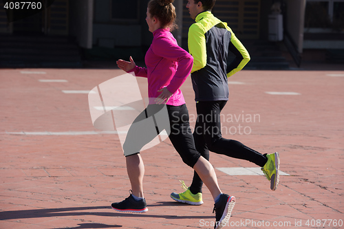 Image of young  couple jogging