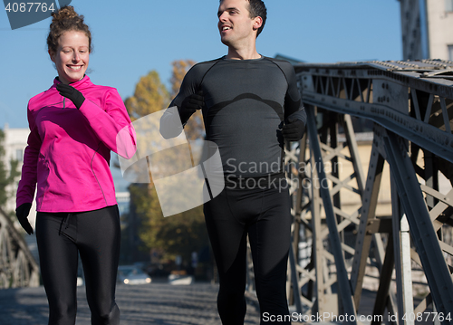 Image of young  couple jogging