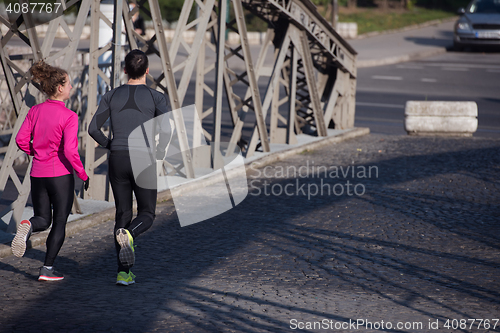 Image of young  couple jogging