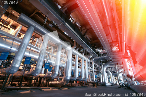 Image of Equipment, cables and piping as found inside of a modern industr