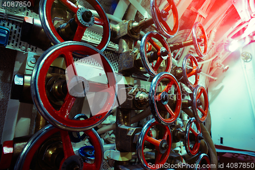 Image of Detailed view of valves and pipes in old submarine    