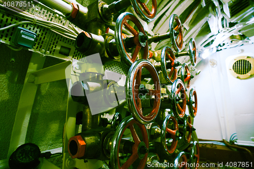 Image of Detailed view of valves and pipes in old submarine    