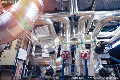 Image of Equipment, cables and piping as found inside of a modern industr
