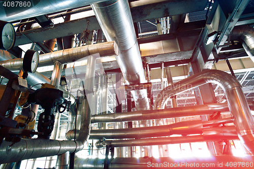 Image of Equipment, cables and piping as found inside of a modern industr