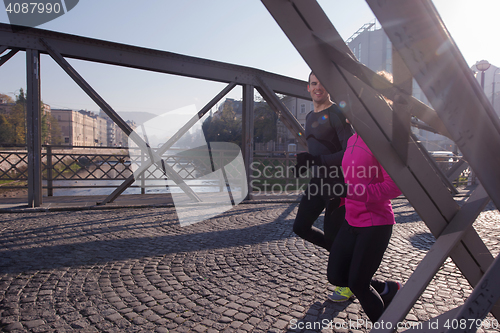 Image of young  couple jogging