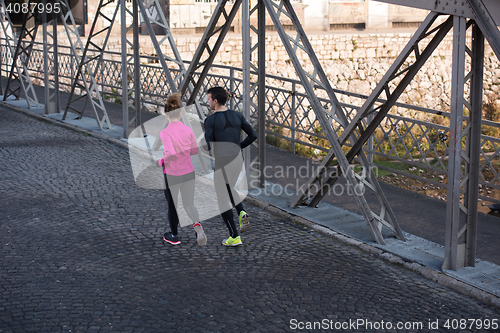 Image of young  couple jogging