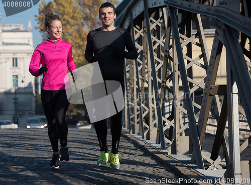 Image of young  couple jogging