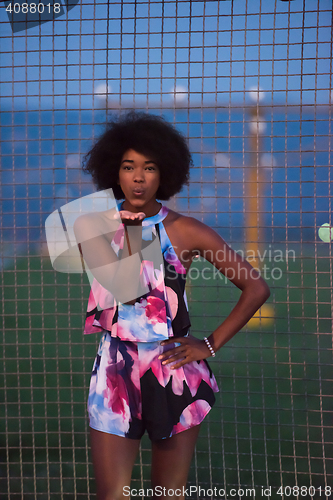 Image of young African-American woman in a summer dress