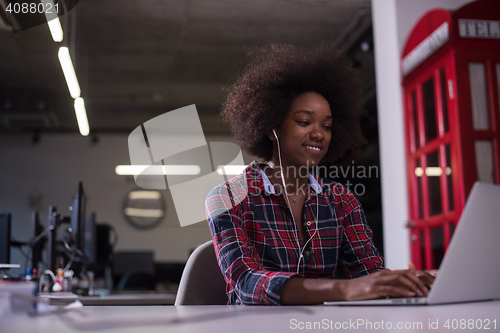 Image of portrait of a young successful African-American woman in modern 