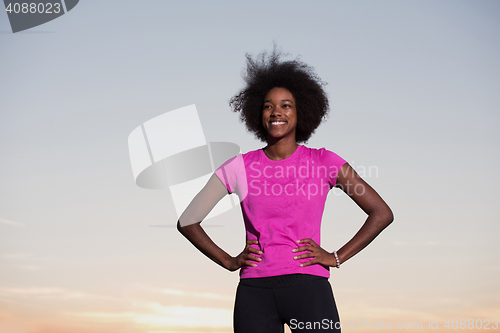 Image of Portrait of a young african american woman running outdoors