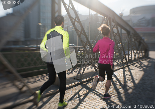 Image of young  couple jogging