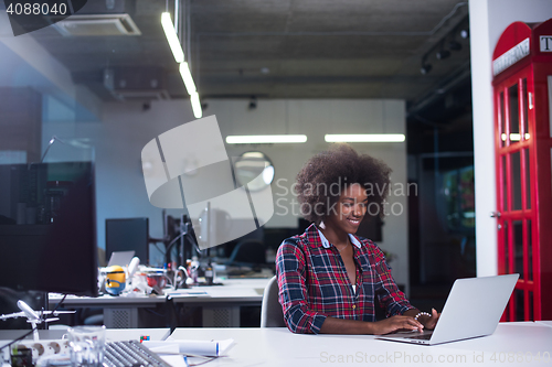 Image of portrait of a young successful African-American woman in modern 