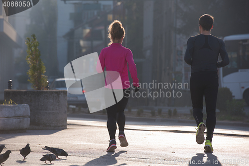 Image of young  couple jogging