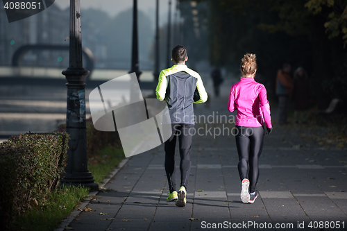Image of young  couple jogging