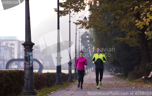 Image of young  couple jogging