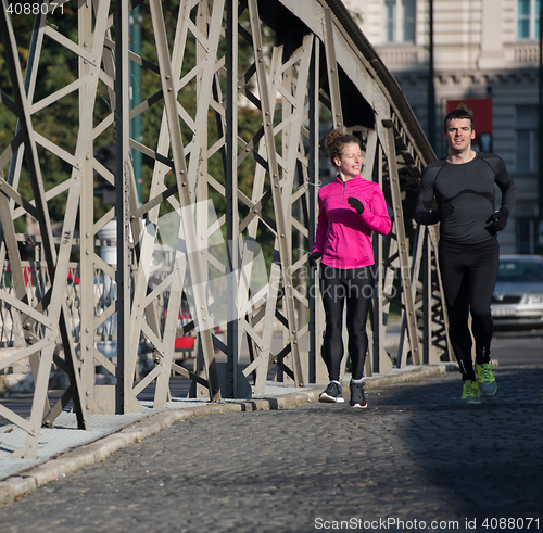 Image of young  couple jogging