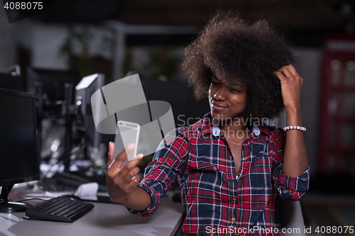 Image of portrait of a young successful African-American woman in modern 