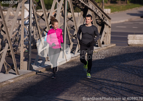 Image of young  couple jogging