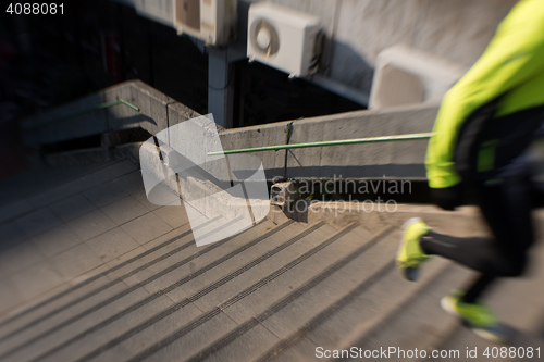 Image of man jogging on steps