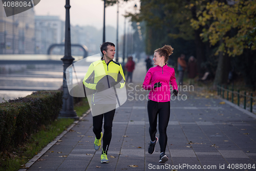 Image of young  couple jogging