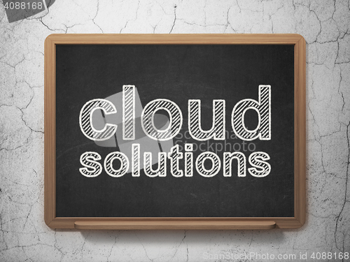 Image of Cloud networking concept: Cloud Solutions on chalkboard background