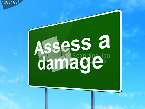 Image of Insurance concept: Assess A Damage on road sign background