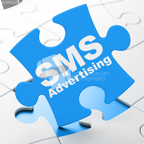 Image of Marketing concept: SMS Advertising on puzzle background