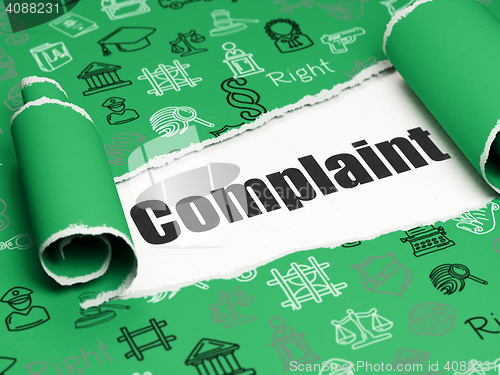 Image of Law concept: black text Complaint under the piece of  torn paper