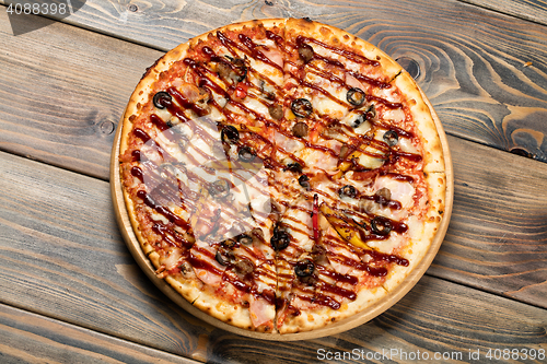 Image of Pizza On An Old Wooden Desk