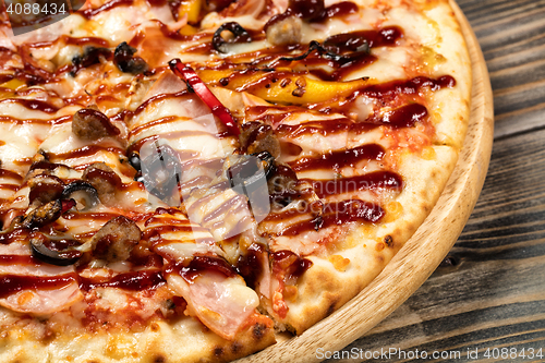 Image of Pizza On An Old Wooden Desk