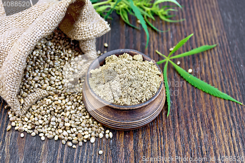 Image of Flour hemp in bowl with grain and bag on board