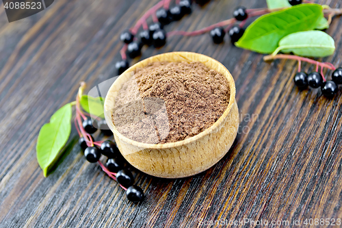 Image of Flour bird cherry in bowl with berries on board