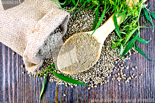 Image of Flour hemp in spoon with bag on board top