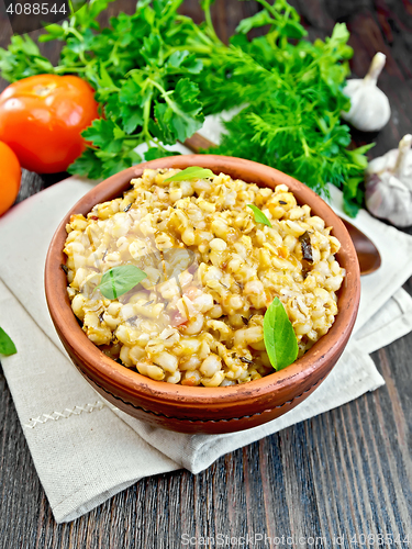 Image of Barley porridge with tomatoes on napkin