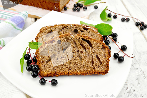 Image of Fruitcake bird cherry in plate on board