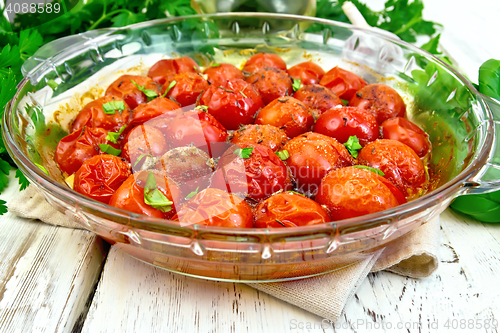 Image of Tomatoes baked in glass pan on light board