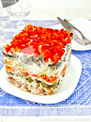 Image of Salad with chicken and peppers on tablecloth