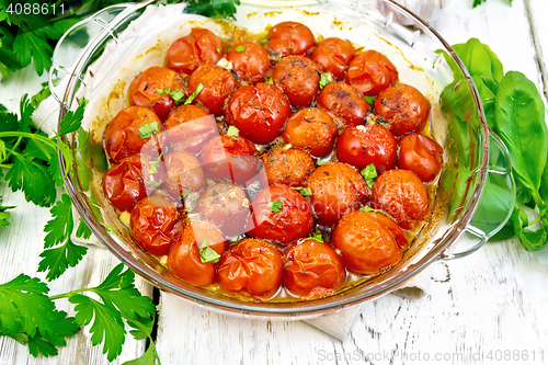 Image of Tomatoes baked in pan on board