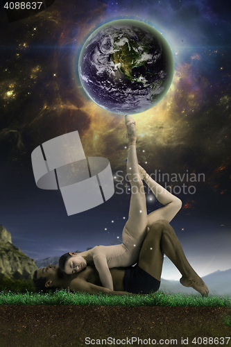 Image of Couple of ballet dancers posing over gray fantasy background
