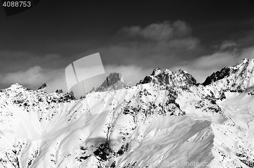 Image of Black and white view on snowy mountains at sun day