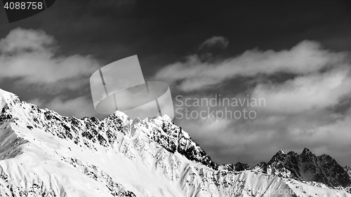 Image of Black and white panoramic view on snow mountains at sun day