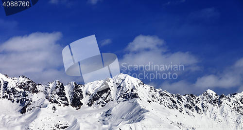 Image of Panoramic view on snow mountains in sunny day