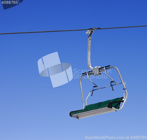 Image of Chair-lift at ski resort and blue clear sky