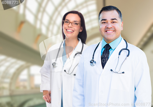 Image of Two Doctors or Nurses Inside Hospital Building