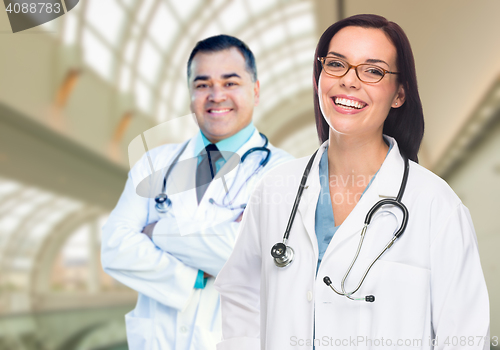 Image of Two Doctors or Nurses Inside Hospital Building