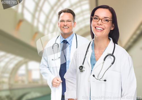 Image of Two Doctors or Nurses Inside Hospital Building