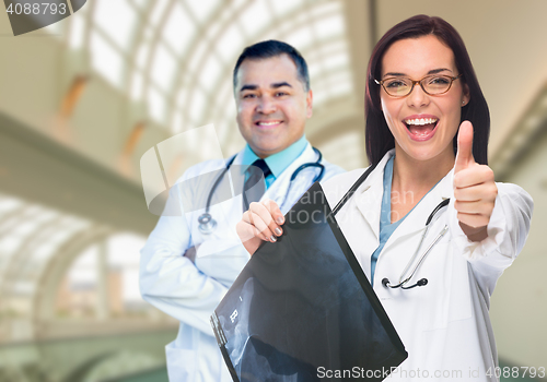 Image of Doctors or Nurses Holding X-ray Inside Hospital