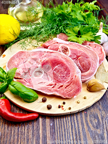 Image of Turkey steak raw with pepper on board