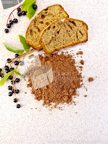 Image of Flour bird cherry with fruitcake on table